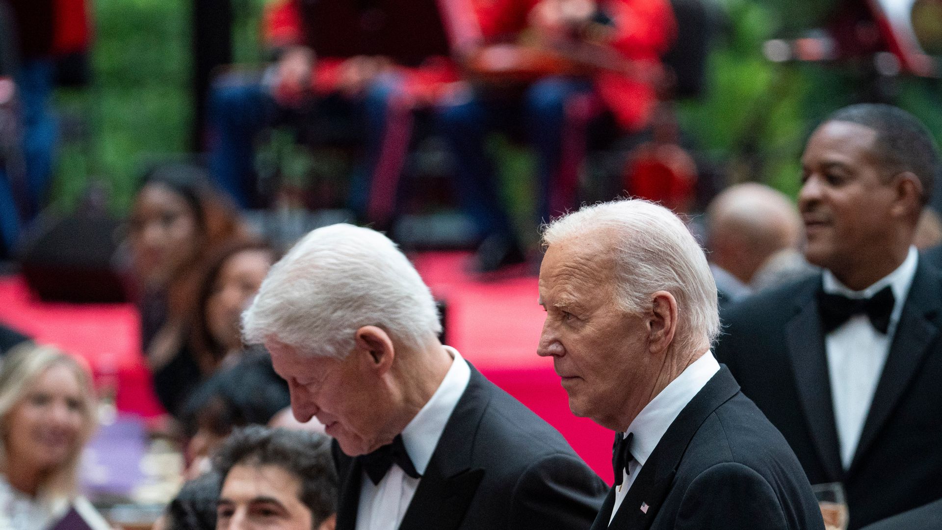 Bill Clinton and Joe Biden stand together at the Kenyan state dinner at the White House